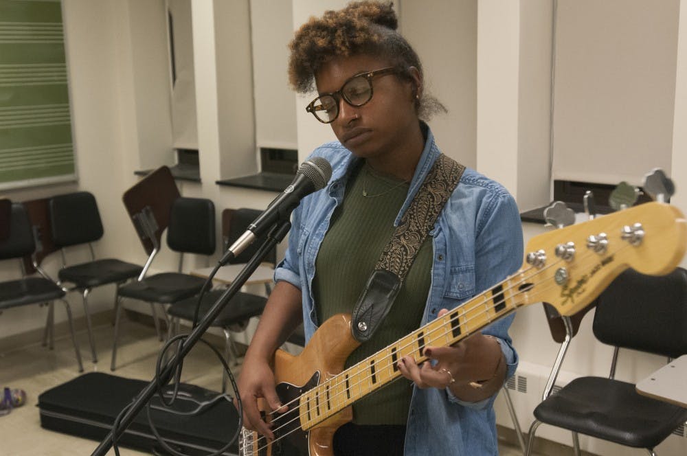 Music composition and jazz studies senior Jordyn Davis plays the bass on Nov. 30, 2016 in the Music Practice Building. Davis and her bandmates were practicing to record an EP.
