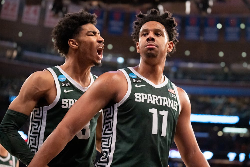 <p>AJ Hoggard and sophomore guard Jaden Akins rally during the Sweet Sixteen matchup against Kentucky State University at Madison Square Garden on March 23, 2023. The Spartans fell to the Wildcats with a score of 98-93.</p>