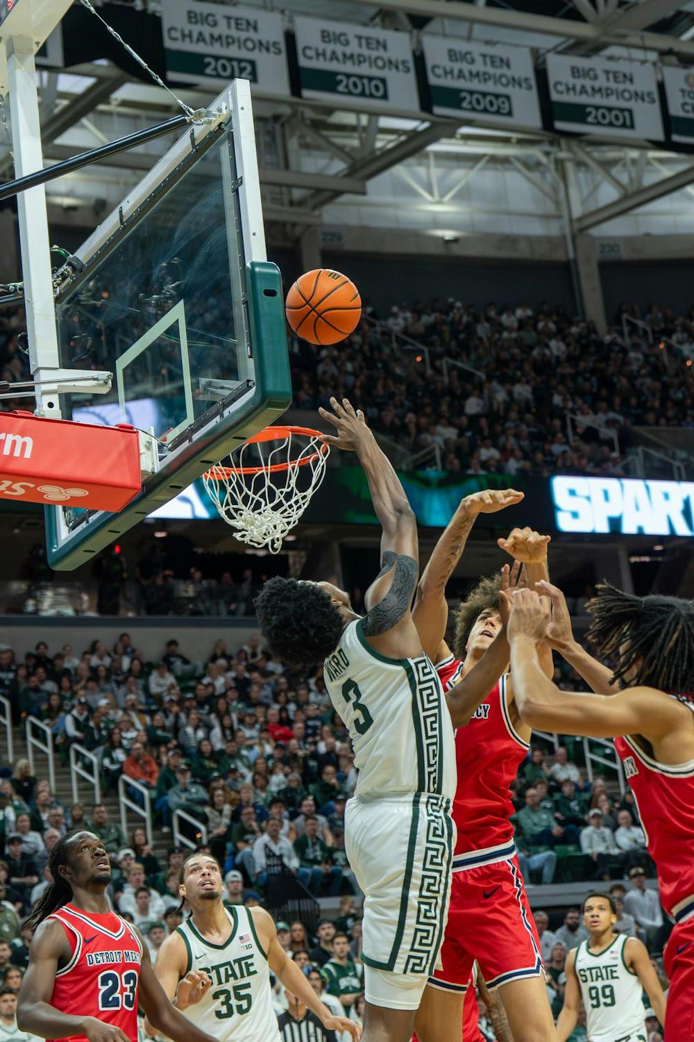 MSU forward Cam Ward (3) goes up for a shot as Detroit Mercy defenders try to block him during the Spartans’ non-conference matchup at the Breslin Center in East Lansing, Mich., on Friday, Nov. 21, 2025.