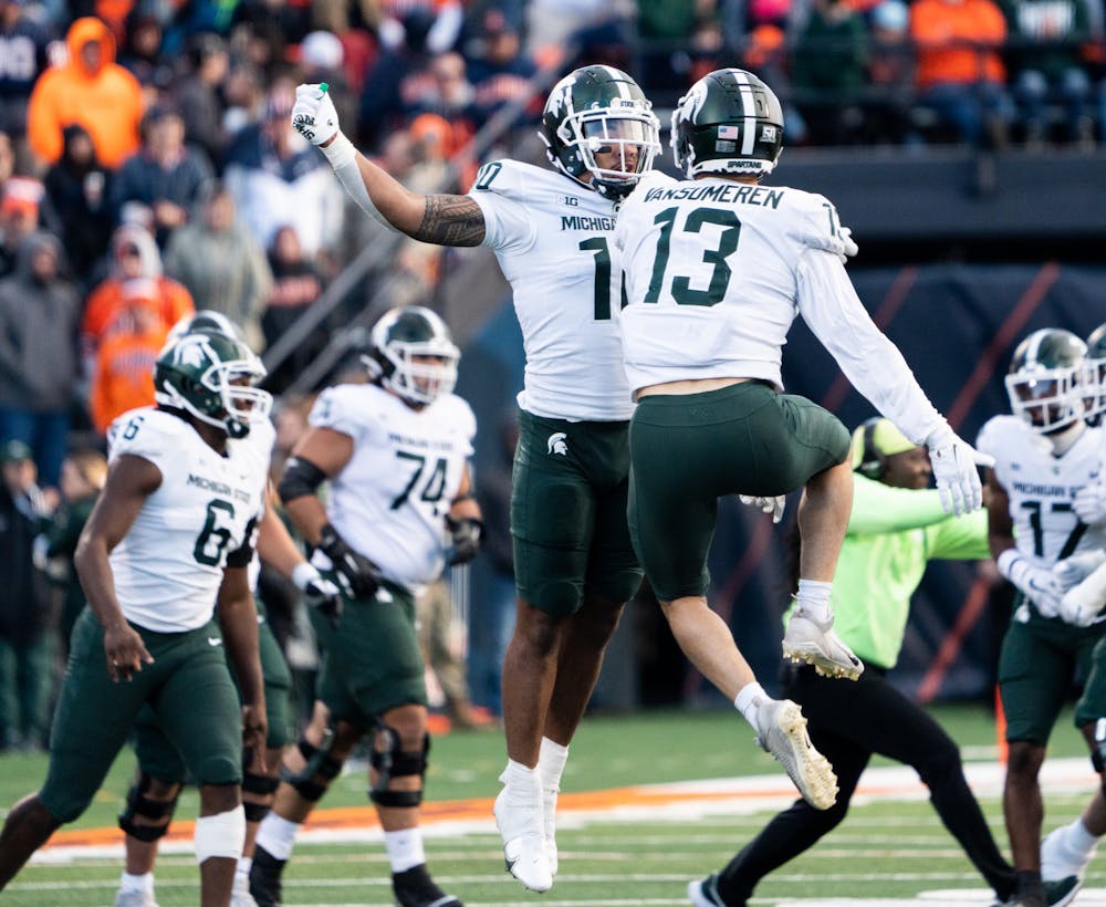 <p>Sophomore linebacker Ma’a Gaoteote (10) and redshirt senior linebacker Ben VanSmuren (13) celebrate after gaining possession of the ball in a game against University of Illinois at Memorial Stadium on Nov. 5, 2022. The Spartans beat the Fighting Illini with a score of 23-15. </p>