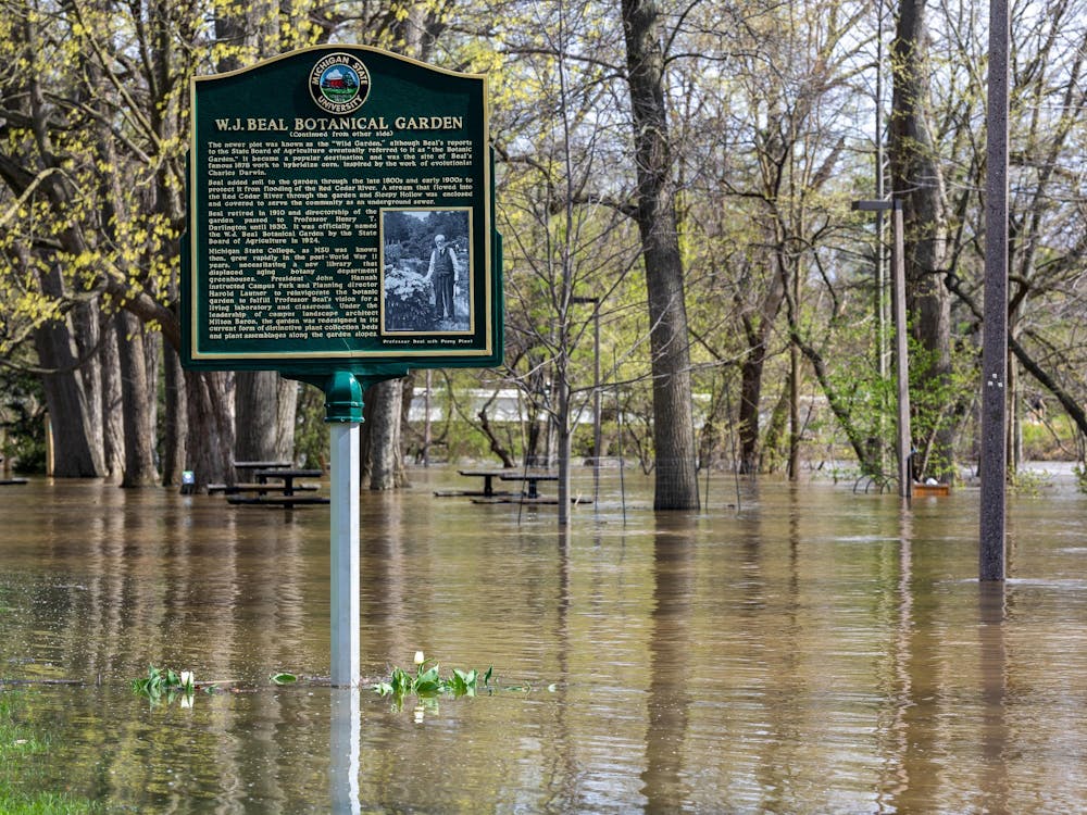 The Red Cedar River floods into Michigan State's Beal Botanical Garden in East Lansing, Michigan on Friday, April 17, 2026. 
