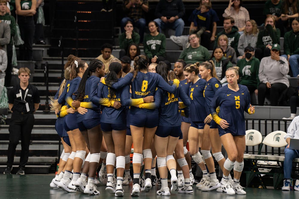 <p>Michigan in a team huddle, at the MSU v. Michigan game held at the Breslin Center on October 14, 2022. The Spartans ultimately fell to the wolverines 3-0.</p>