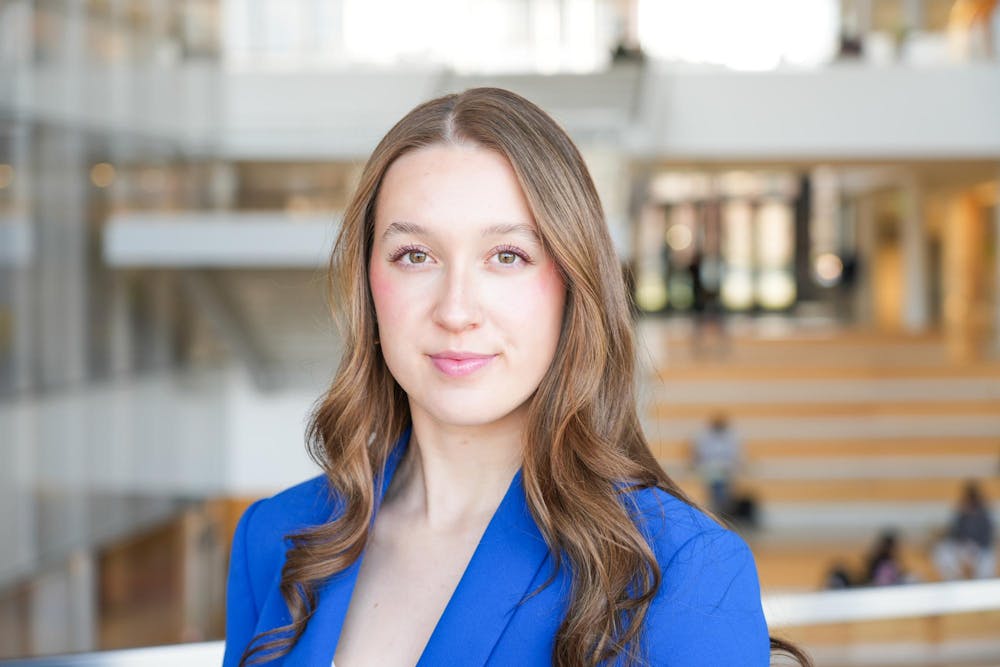 Freshman Alina Morse poses for a photo in the Minskoff Pavillion at Michigan State University on Thursday, March 8, 2023. Morse is the founder and CEO of Zolli Candy, a zero-sugar candy company she founded when she was ten years old. Morse said MSU's entrepeneurship program made the school stand out above her other options.