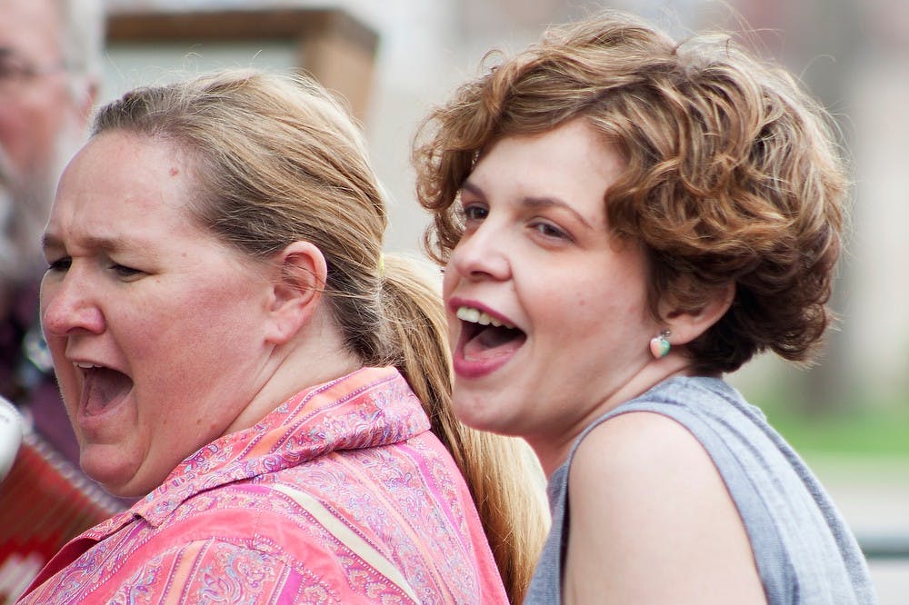 	<p>Singers Jenn Hill, left, and Iris Thompson, with the Lansing Unionized Vaudeville Spectacle, practice with rest of the band June 2, 2013, at a band member&#8217;s house in Lansing. Hill said music is one of the purest forms of expression she has. Julia Nagy/The State News</p>