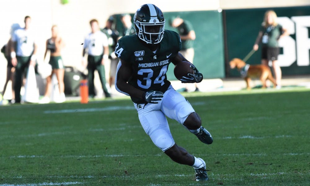 <p>Freshman tailback Anthony Williams Jr. (34) runs the ball down the field in the third quarter. The Spartans fell to the Sun Devils 10-7 at Spartan Stadium on Sept. 14, 2019.</p>