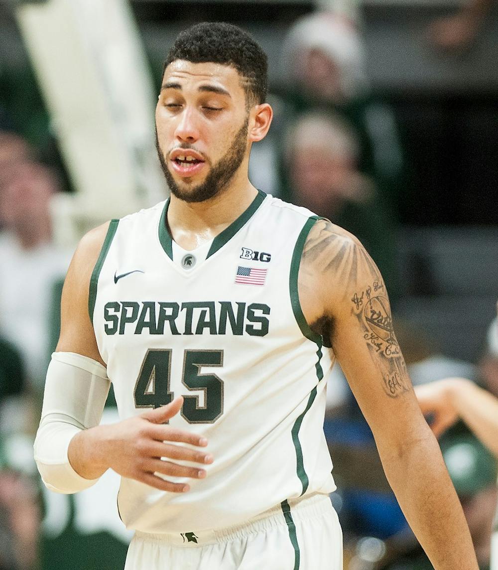 <p>Junior guard Denzel Valentine walks down the court after being punched int he face Dec. 20, 2014, during the game against Texas Southern at Breslin Center. The Spartans were defeated by the Tigers, 71-64. Erin Hampton/The State News</p>