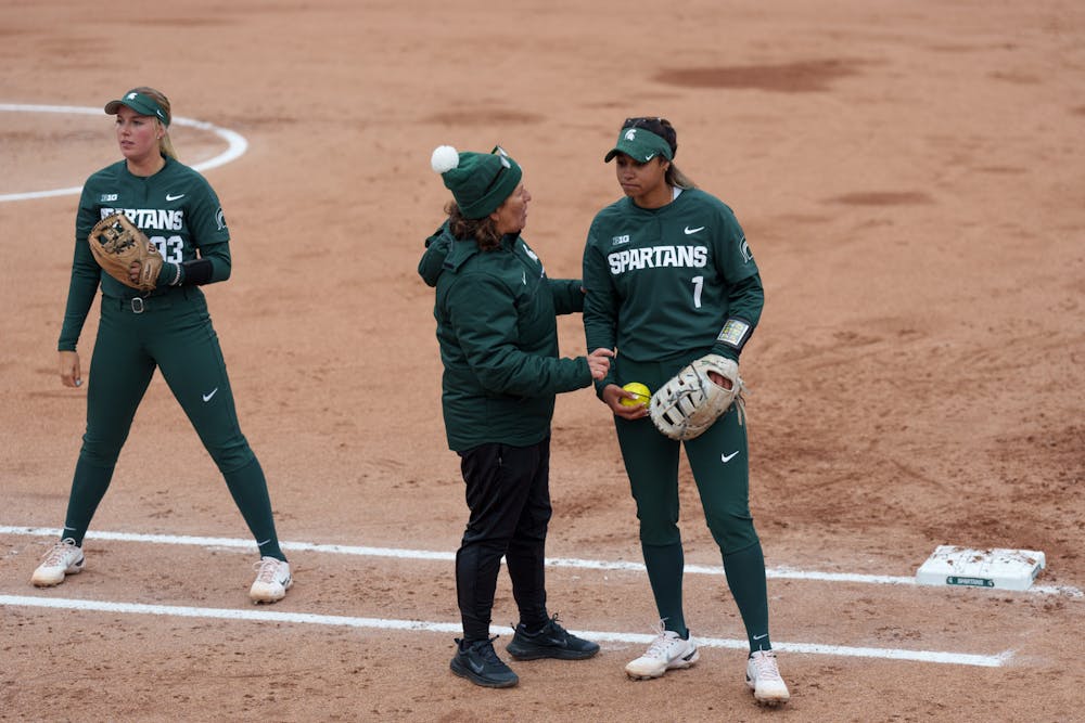 <p>Michigan State head coach Jacquie Joseph talking with junior Camryn Wincher between innings. Spartans lost 6-0 against Nebraska, on April 9, 2022.</p>