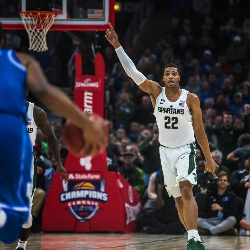 <p>Sophomore forward and guard Miles Bridges (22) reacts to the Spartans scoring a basket during the Champions Classic during the game against Duke on Nov. 14, 2017 at the United Center. The Spartans were defeated by the Blue Devils, 81-88.&nbsp;</p>