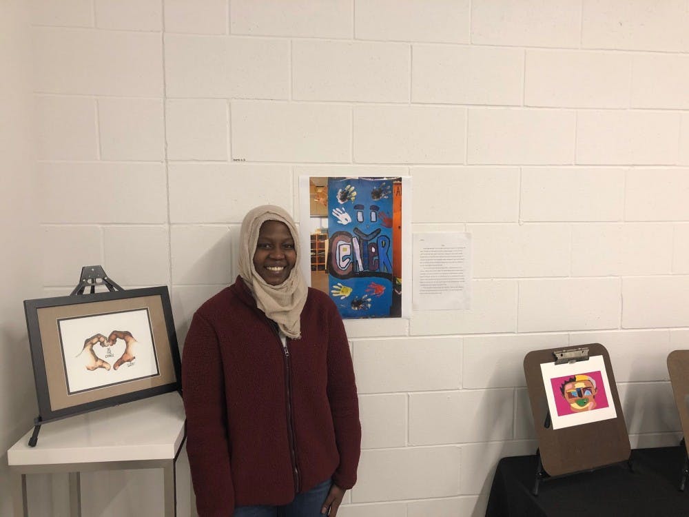 <p>Mark S. McDaniel Legacy Scholarship finalist Siham Hassan presents her painting at the Broad Art Lab.</p>