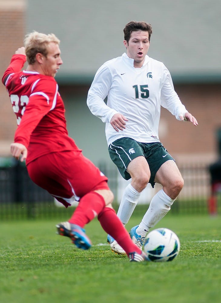Senior forward/midfielder Nick Wilson fights for control of the ball against Indiana's defender Caleb Konstanski on Oct. 28, 2012, at DeMartin Stadium at Old College Field. The Spartans defeated the Hoosiers 3-1.