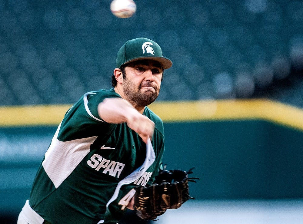 	<p>Junior right-handed pitcher Mike Theodore delivers a pitch Wednesday, April 17, 2013, at Comerica Park in Detroit. The Spartans lead Central Michigan, 1-0, in the 5th inning during a rain delay. The remainder of the game is set to be played May 14 in Mt. Pleasant. Adam Toolin/The State News</p>