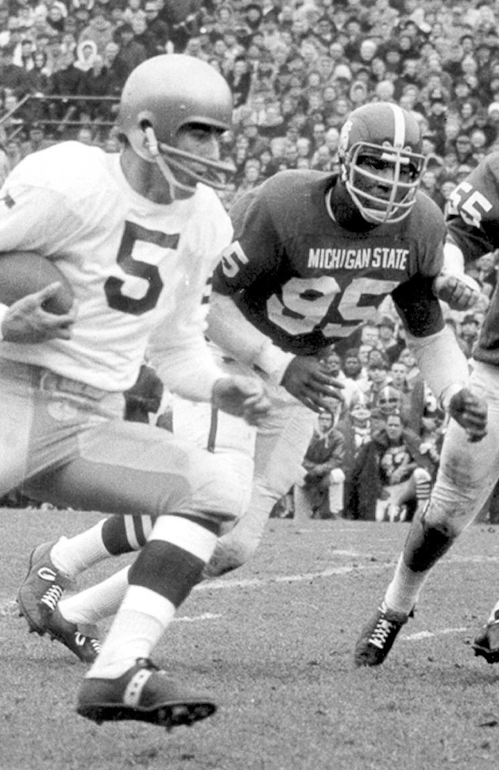 	<p>Charles &#8220;Bubba&#8221; Smith, right, closes in on an opponent. Smith, a former defensive end for the Spartans, was found dead in his Los Angeles home Wednesday. </p>