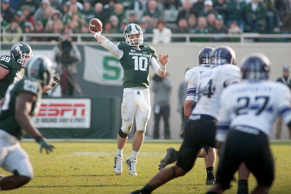 	<p>Junior quarterback Andrew Maxwell attempts a pass on Saturday, Nov. 17, 2012, at Spartan Stadium. Northwestern defeated the Spartans&#8217; 23-20. James Ristau/The State News</p>