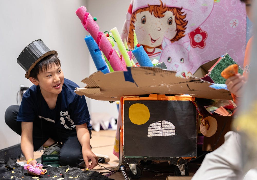  Odyssey of the Minds competitor Vincent Pen works alongside his team as they work on their vehicle for the OM-Mazing Race​ in the Jack Breslin Center in East Lansing, Michigan on May 22, 2025. 