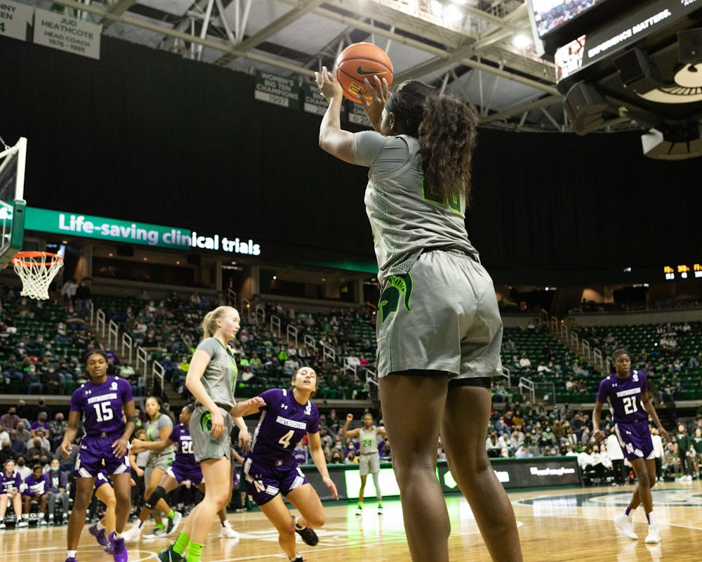 Jayla James, Junior Forward for Michigan State, tries to score a three point shot. Michigan State went on to win against Northwestern 65-46.