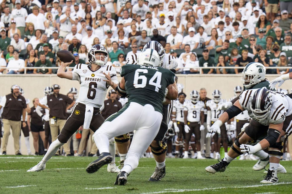 <p>Jack Salopek, 6, passes the ball during Michigan State’s home opener against Western Michigan at Spartan Stadium on Sept. 2, 2022. The Spartans ultimately beat the Broncos, 35-13.</p>