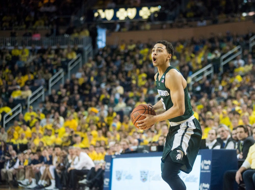 Senior guard Bryn Forbes prepares to shoot the ball during the second half of the game against Michigan at Crisler Center in Ann Arbor on Feb. 6, 2016.  The Spartans defeated the Wolverines, 89-73.