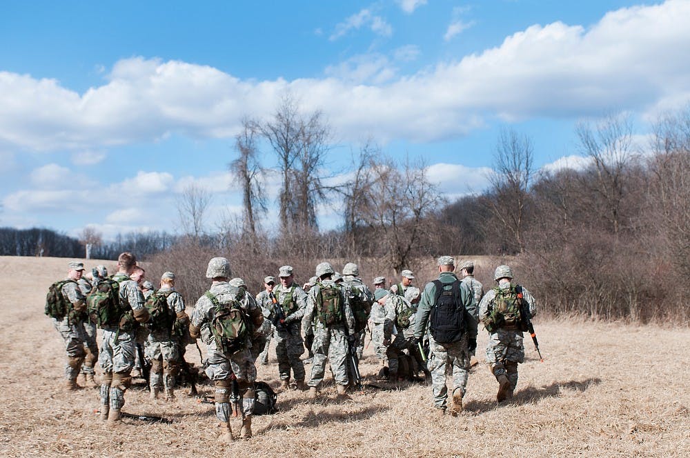 	<p><span class="caps">ROTC</span> members brief after an exercise Tuesday at a wooded lot located on the southern end of campus. They discussed things to improve upon for upcoming exercises. Julia Nagy/The State News</p>