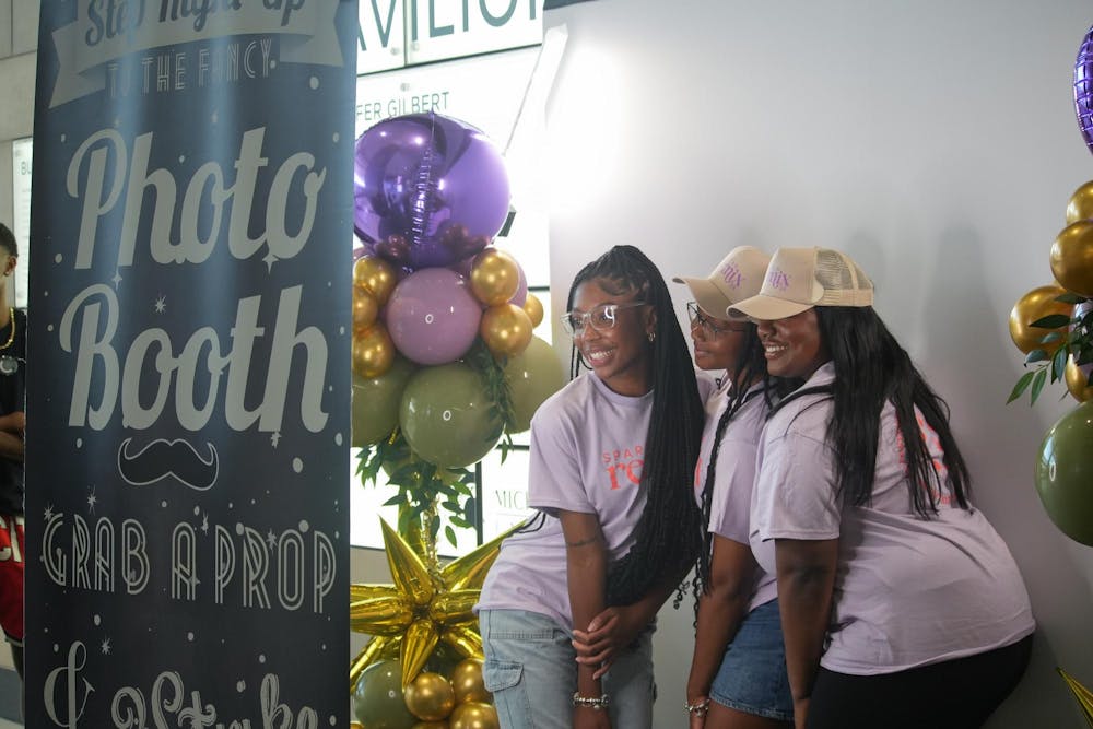 <p>Students pose at the Spartan Remix photo booth with all of their Spartan Remix gear on Sept. 5th, 2024. Spartan Remix is a student event for multicultural student organizations that helps get their name out to new and prospective students.</p>