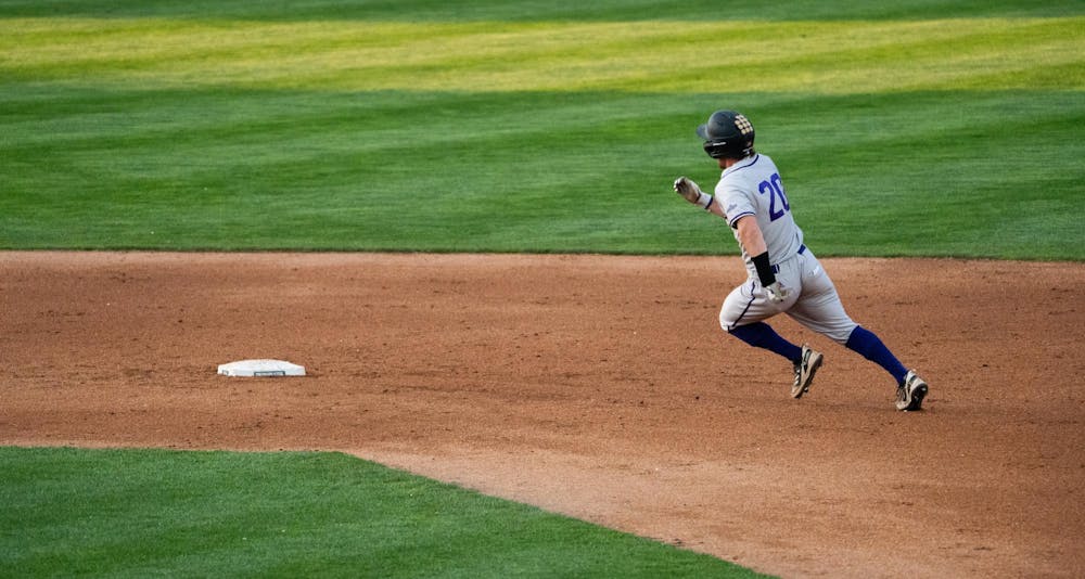 <p>WIU outfielder Nick Mitchell rounds the bases at McLane Baseball Stadium on Friday, April 14, 2023. Mitchell scored early in the Friday night matchup.</p>