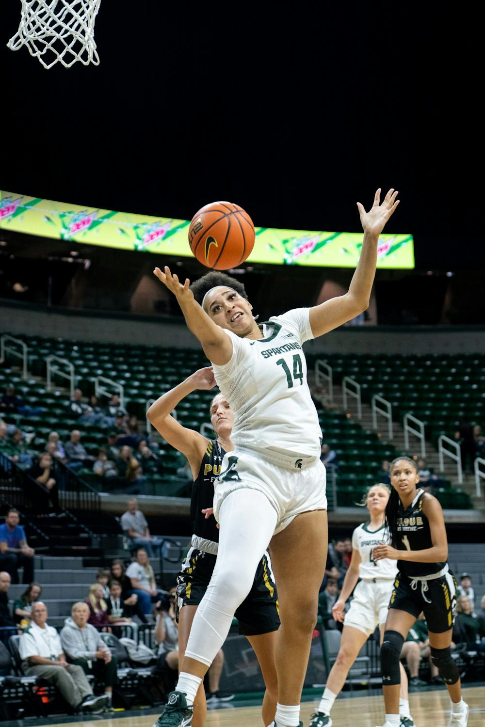 Senior forward Taiyier Parks (14) shoots a shot during a game against Purdue Fort Wayne at Breslin Center on Nov. 10, 2022. The Spartans defeated the Mastodons with a score of 85-53.