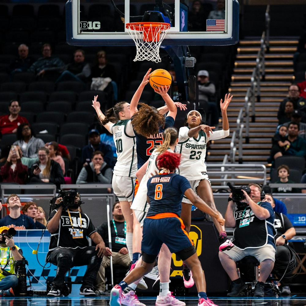 Illinois So. F, Berry Wallace (23), shoots the ball while being defended by MSU players, So. F, Inés Sotelo (10) and Sr. G, Jalyn Brown (23) in the Gainbridge Fieldhouse in Indianapolis, IN on March 5, 2026.