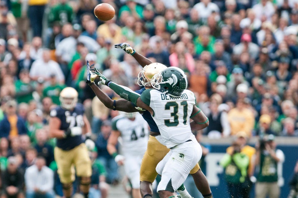 	<p>Notre Dame wide receiver DaVaris Daniels goes up for a catch as Darqueze Dennard defends, Sept. 21, 2013, at Notre Dame Stadium. The Spartans fell to the Irish, 17-13. Khoa Nguyen/ The State News</p>