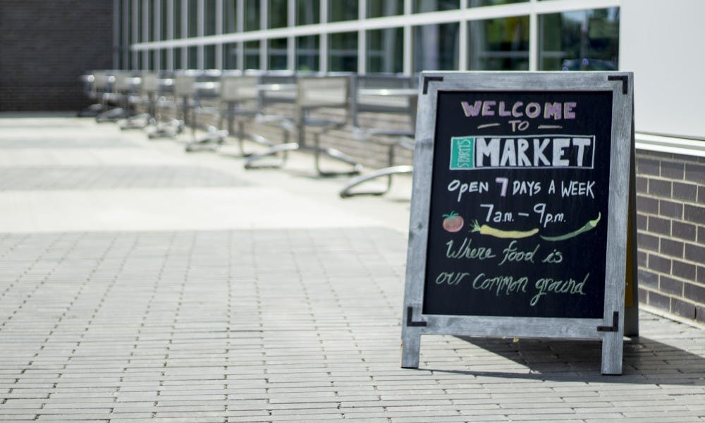 <p>A sign outside of Sparty's Market on Aug. 30, 2017. The market features a deli counter, produce, laundry needs, and a Starbucks.</p>