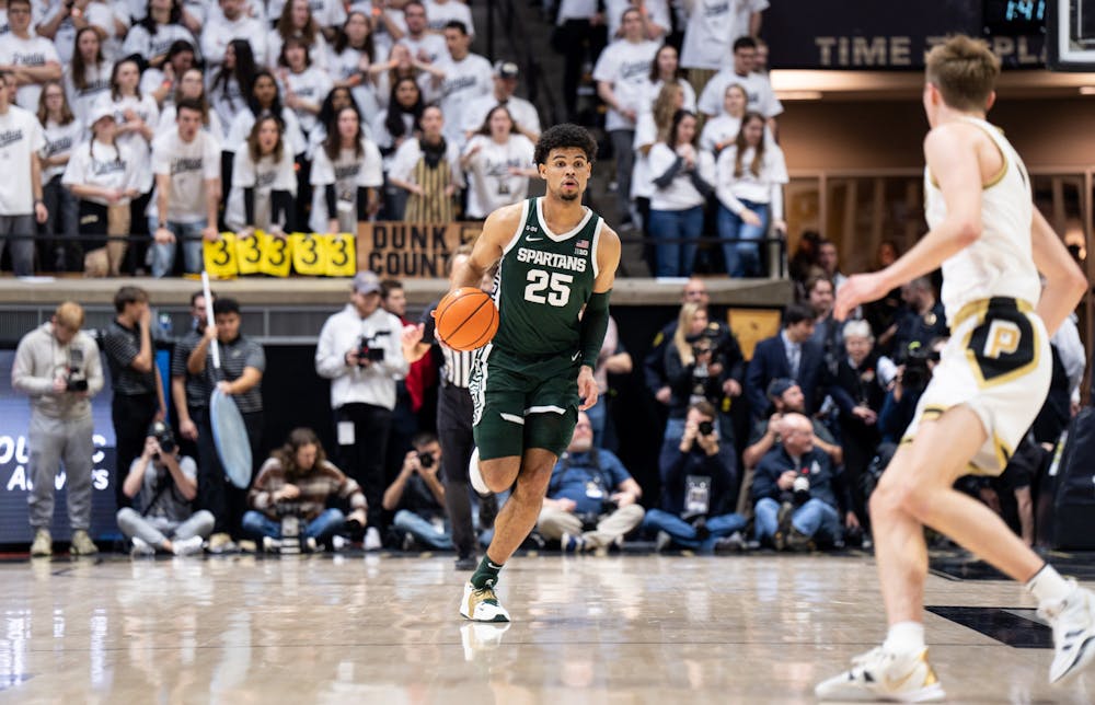 <p>Senior forward Malik Hall (25) dribbles the ball during a game against Purdue at Mackey Arena on Jan. 29, 2023. The Spartans lost to the Boilermakers 77-61.</p>