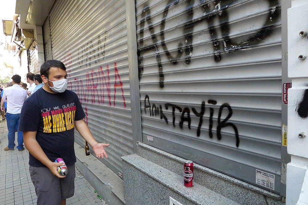 	<p>Graffiti artist admires his work on a main pedestrian street, the Istiklal, in Istanbul, Turrkey, Saturday, June 1, 2013. Police and protestors clashed during the day in the city. (Roy Gutman/MCT)</p>