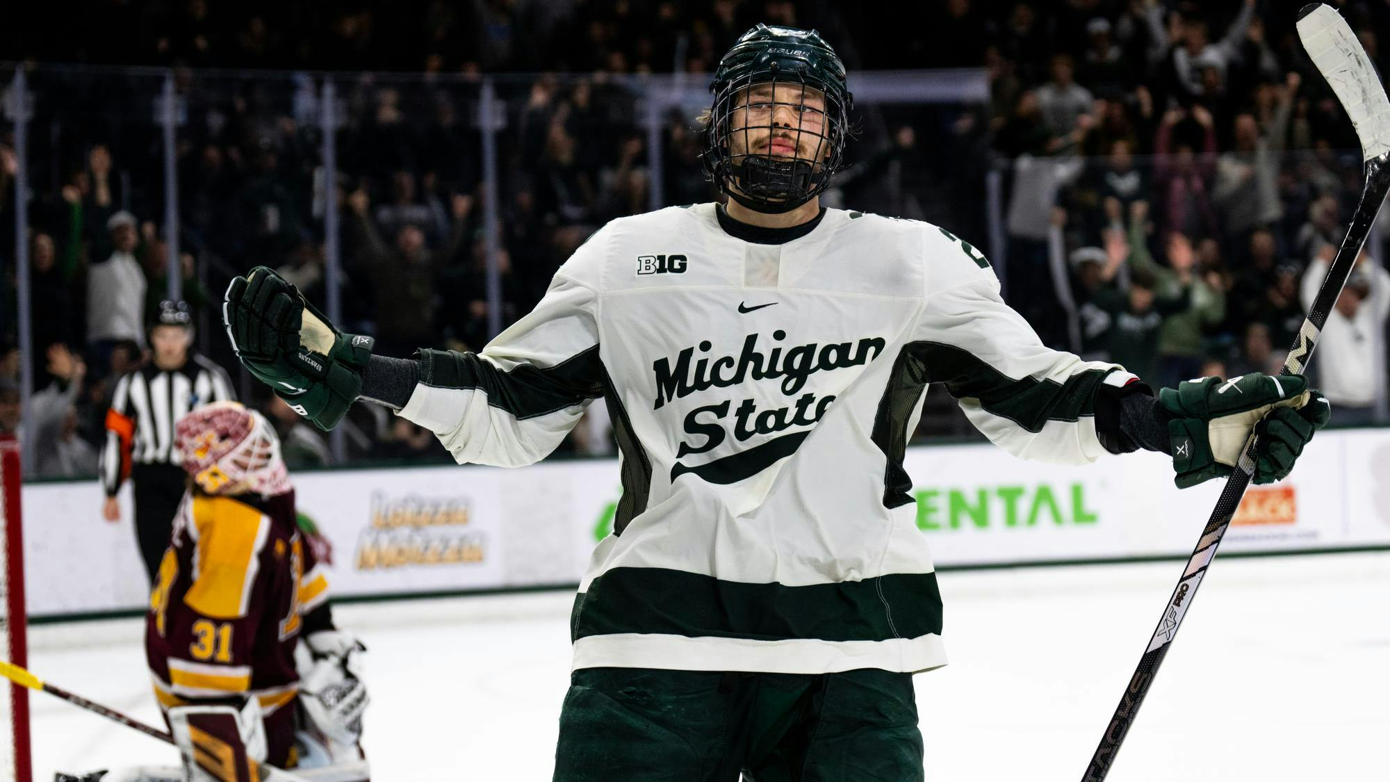 Michigan State junior forward Isaac Howard (22) celebrates scoring the game-winning goal in the shootout at Munn Ice Arena on Jan. 25, 2025. The Spartans completed the season sweep of the Golden Gophers following a 4-3 shoot out victory.