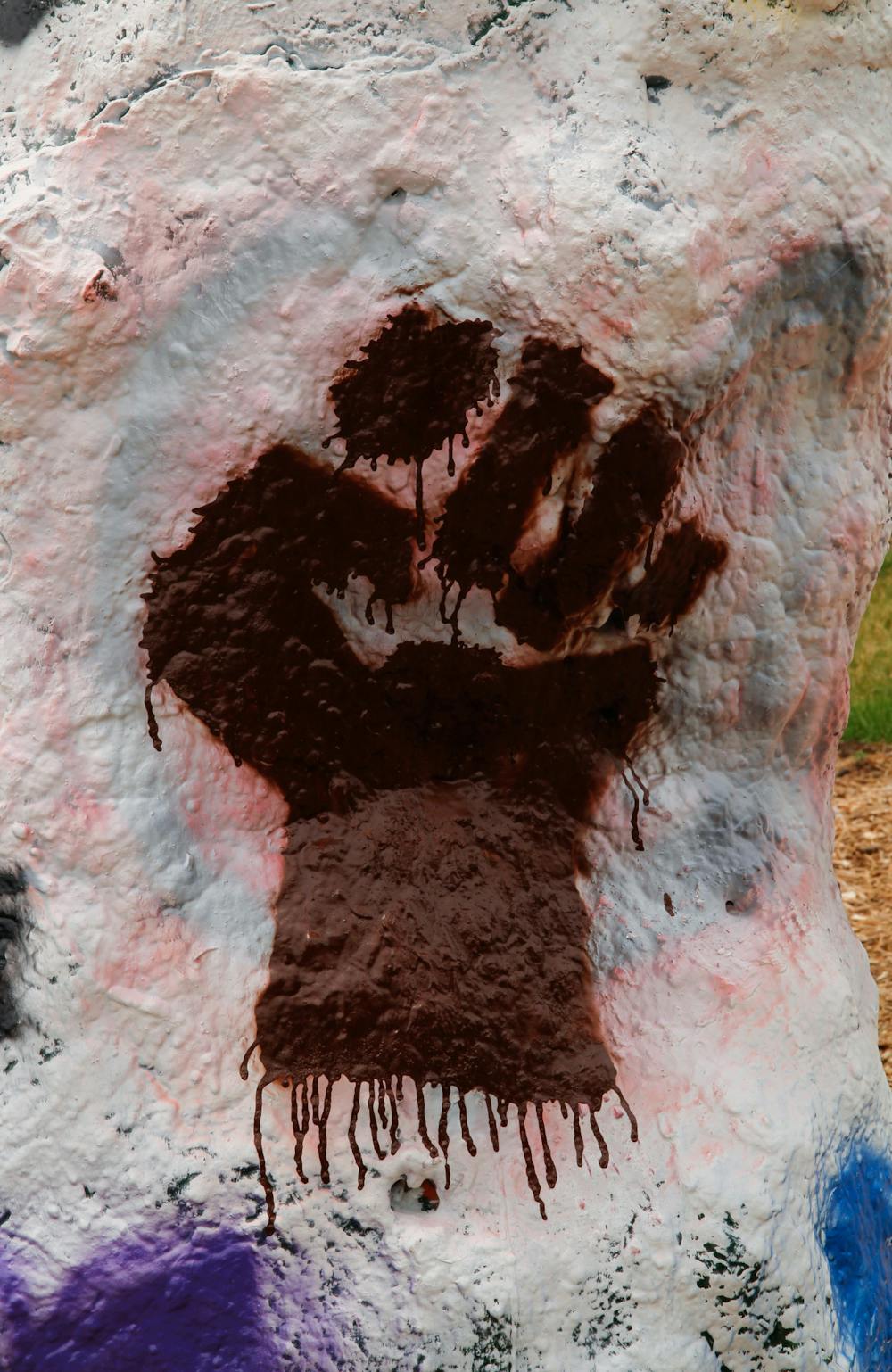 <p>The Rock on Farm Lane dawned other insignias like the Black Lives Matter fist. This represents not just people of color within the LGBTQ+ community, but also solidarity with the Black Lives Matter movement.  Photographed on  June 7, 2021.</p>