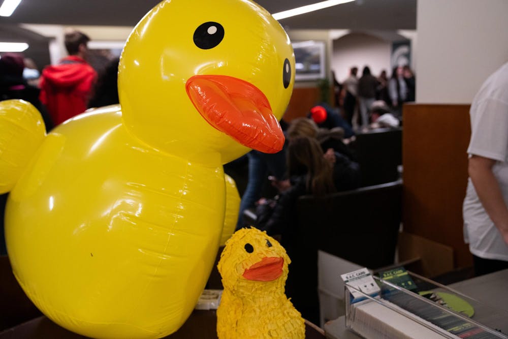 An inflatable rubber duck marks the end of a line of over 300 students at the Michigan State union waiting to get free shirts from the Alcohol and Other Drugs Program during their Farewell to the Flock event on Dec. 2, 2024.