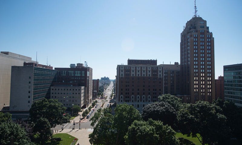 <p>The view of Michigan Avenue from the roof of the Capitol building in Lansing, July 28, 2015. This was the first time that people other than construction workers or government officials were allowed to step out onto the roof of the building. Catherine Ferland/ The State News</p>