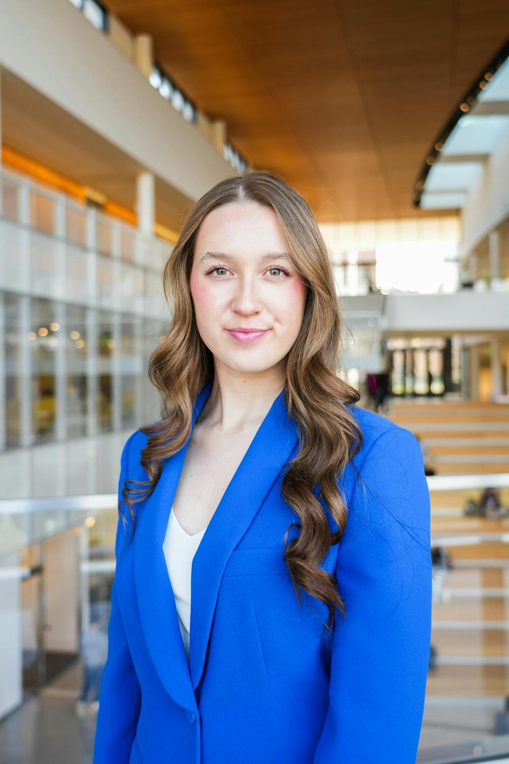 Freshman Alina Morse poses for a photo in the Minskoff Pavillion at Michigan State University on Thursday, March 8, 2023. Morse is the founder and CEO of Zolli Candy, a zero-sugar candy company she founded when she was ten years old. Morse said MSU's entrepeneurship program made the school stand out above her other options.