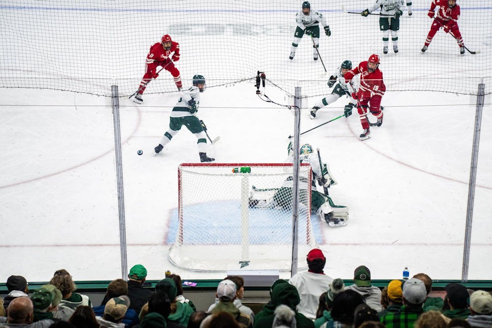 <p>Wisconsin forward Quinn Finley (19) attempts a shot during a game against Michigan State at Munn Ice Arena in East Lansing, Mich., on Saturday, Nov. 22, 2025.</p>