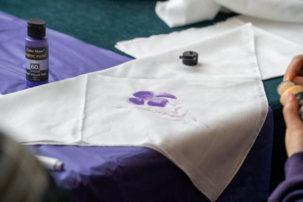 <p>A student paints a bandana during "It's on Us Week," partnering with the Bandana Project to raise awareness for sexual violence on April 5, 2023, in Brody Square Atrium.  </p>