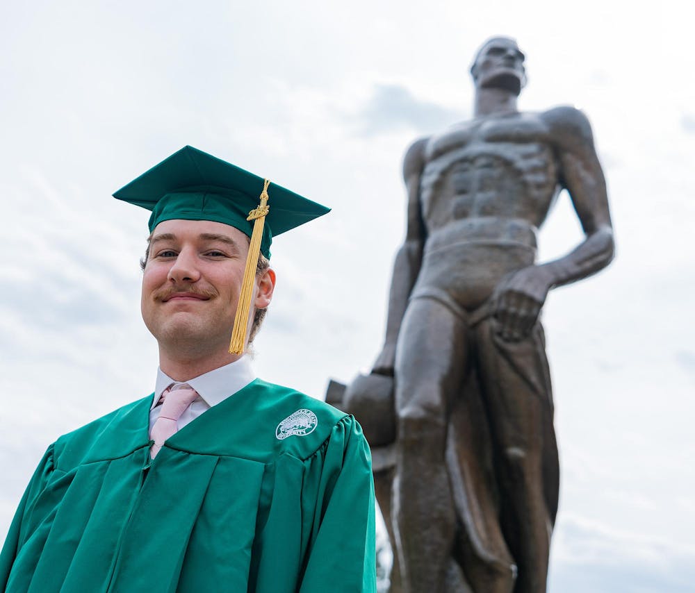Transfer Student, Will Hansen, discussing his time at MSU transferring from a smaller community college in front of the Spartan Statue on April 19, 2023.