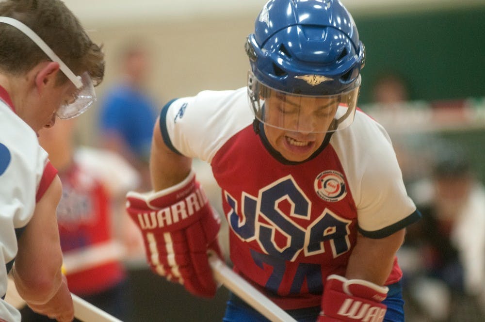 	<p>New York, N.Y., resident Edward Andrews, right, fights for the puck during a floor hockey face-off August 9, 2013, during the World Dwarf Games at IM West. Andrews scored two goals for <span class="caps">USA</span> in a 6-4 victory. Weston Brooks/The State News</p>
