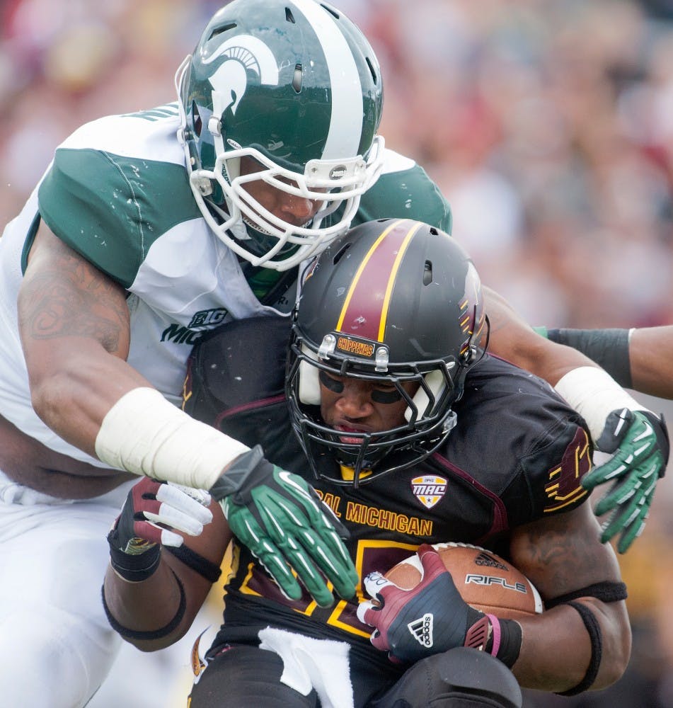 Junior defensive end William Gholston takes down Central Michigan's Courtney Williams. The Spartans defeated the Chippewas, 41-7, on Saturday, Sept. 8, 2012, at Kelly/Shorts Stadium in Mount Pleasant, Mich. Justin Wan/The State News