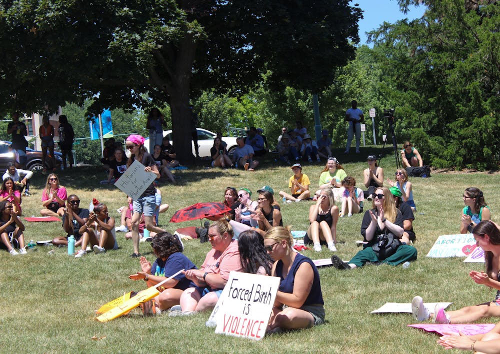 <p>Students gather at The Rock on Farm Lane at an emotional rally to protest the recent overturning of Roe V. Wade on July 10, 2022. </p>