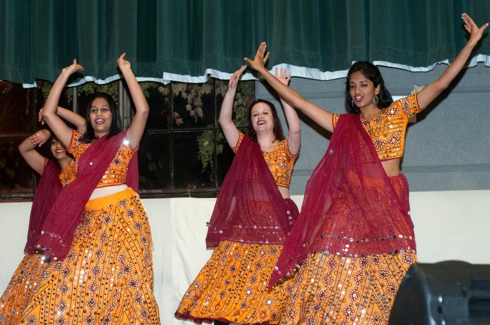 <p>Law student Juhi Pancholi, back left, graduate student Rohitha Edara, front left, law student Hattie Cable, center, and graduate student Pranathi Ramaswamy, front right, dance during Sargam, an event put on by the MSU Indian Students Organization, on Nov. 7, 2015 in Demonstration Hall. Sargam featured traditional Indian dances mixed with modern dances, musical performances, a skit and a fashion show that showed the audience many different elements of Indian culture.   </p>