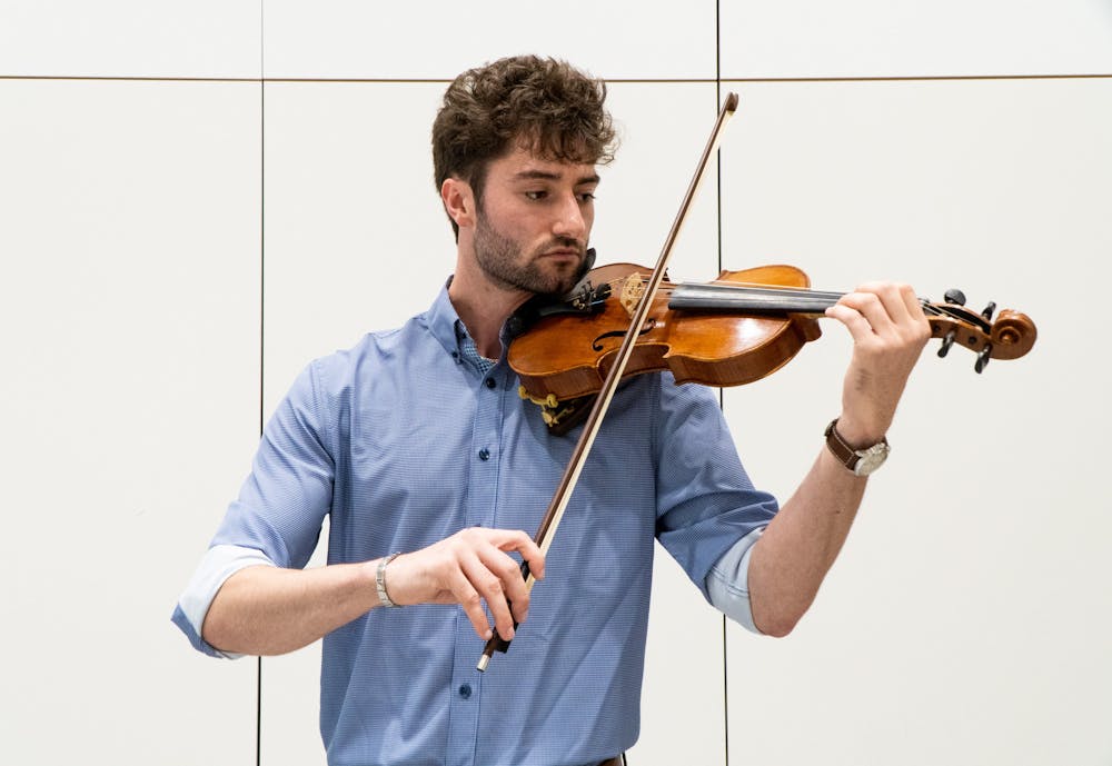 <p>Human biology senior James Cozzi plays his violin in a rehearsal room at Michigan State University&#x27;s College of Music on Sept. 21, 2022. </p>