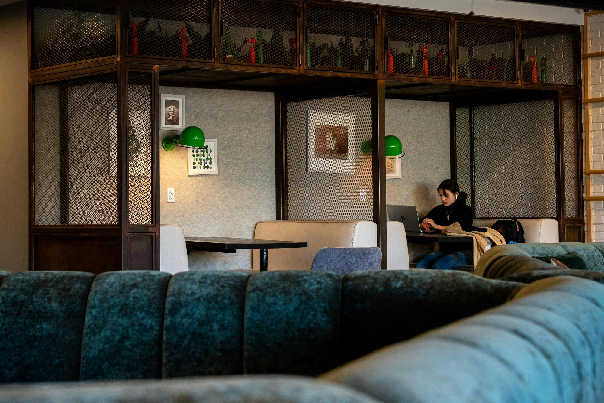 <p>MSU sophomore, Ann Jugo, 19, works in the common area on the mezzanine floor at the Hub On Campus Apartment Complex in East Lansing, Michigan on Sunday, Oct. 26, 2025.</p>