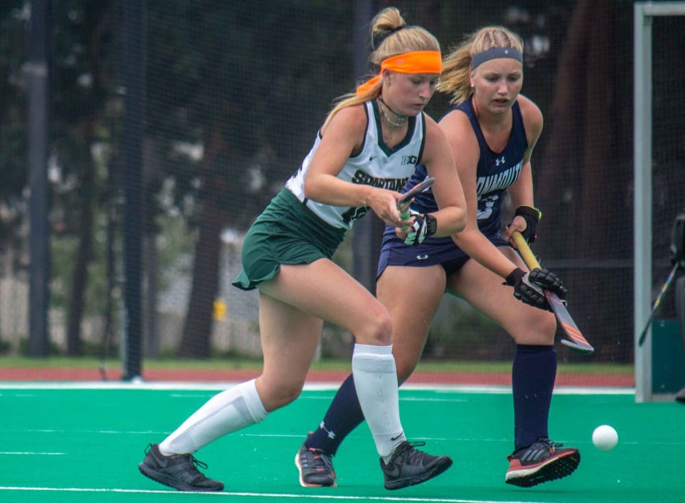 Freshman forward Isa Van Der Weij (16) and Monmouth’s defense Lotte Boom (23) run during the game against Monmouth at Ralph Young Field on Sept. 7, 2018. The Spartans defeated the Hawks in a double overtime shootout, 2-1.