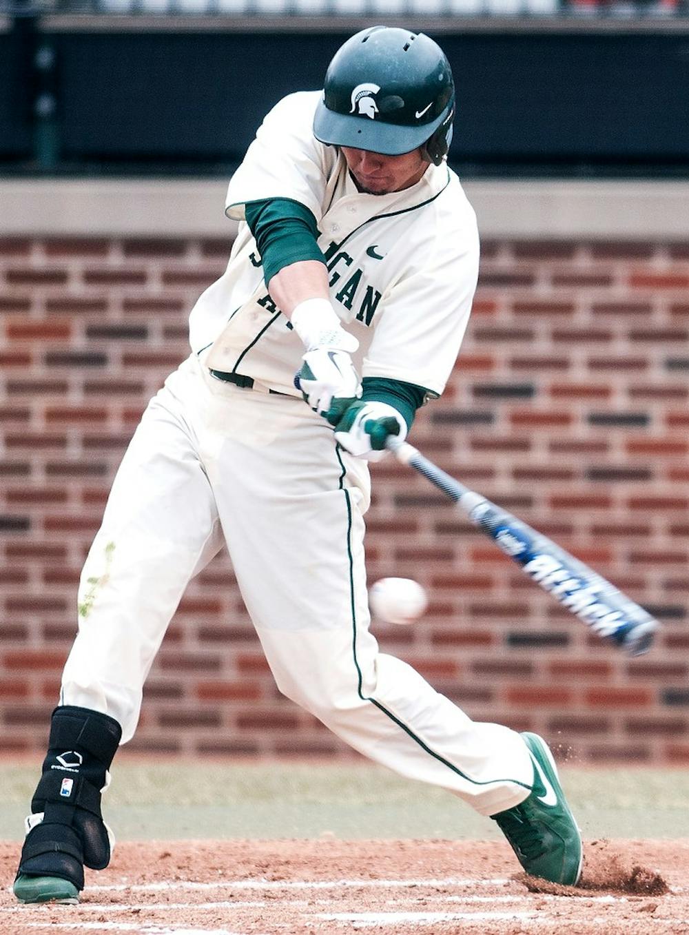 	<p>Sophomore center fielder Anthony Cheky connects with a pitch Sunday, April, 7, 2013, at McLane Stadium at Old College Field. Michigan defeated <span class="caps">MSU</span>, 6-2, during the third game of the weekend series. Adam Toolin/The State News</p>