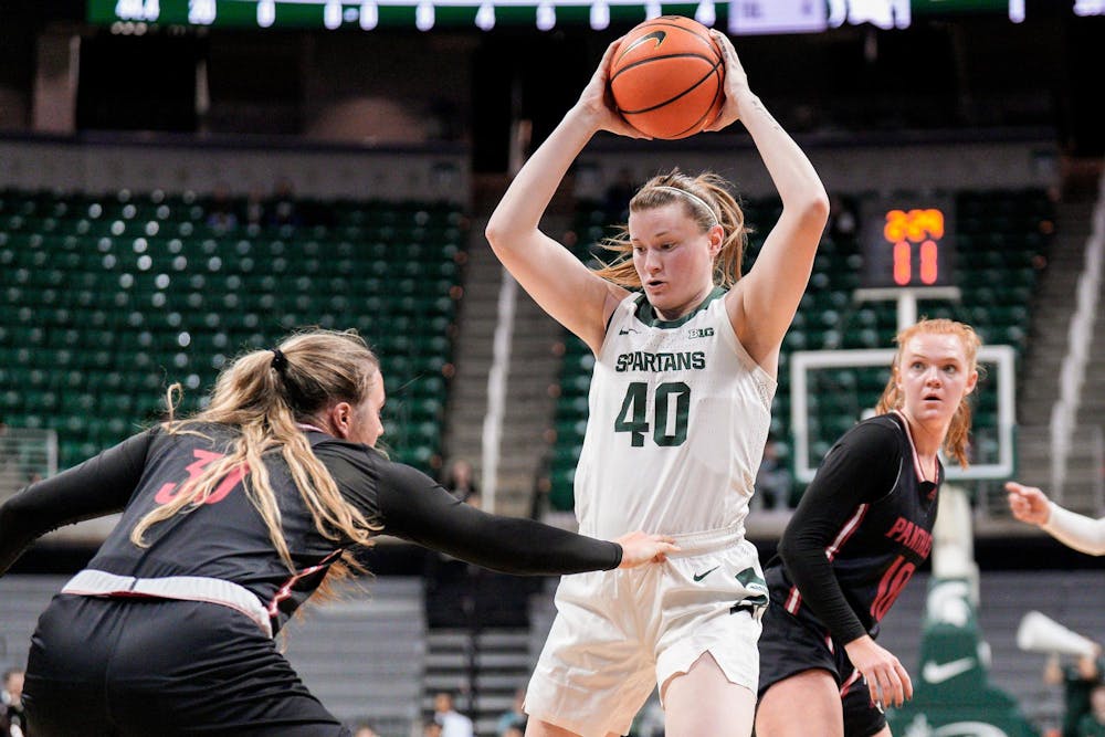 <p>Graduate student guard Julia Ayrault (40) avoids defensive players during the season opening exhibition game against Davenport University at the Breslin Center on Nov. 2, 2023.</p>
