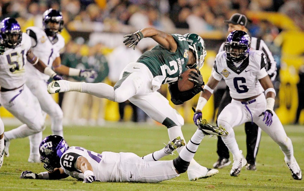 	<p><span class="caps">MSU</span> running back Le&#8217;Veon Bell is tripped up at the line of scrimmage by Texas Christian&#8217;s Kevin White (25) in the Buffalo Wild Wings Bowl at Sun Devil Stadium in Tempe, Arizona, on Saturday, December 29, 2012. (Ron T. Ennis/Fort Worth Star-Telegram/MCT)</p>