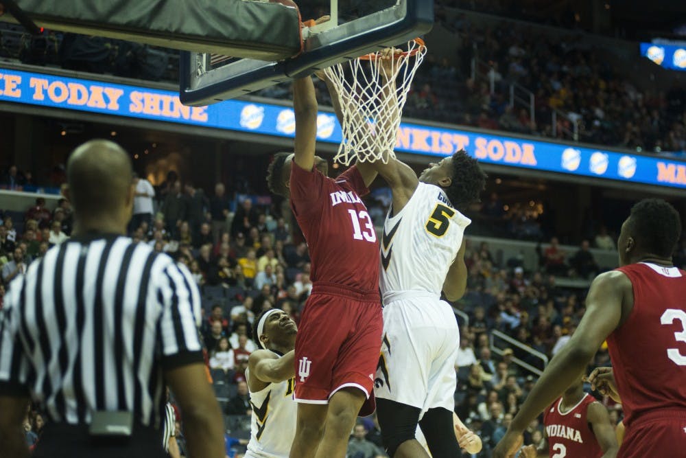 Indiana sophomore forward Juwan Morgan (13) goes for a dunk as Iowa freshman forward Tyler Cook (5) rebounds the ball in the second half of the game during the second round of the Big Ten Tournament on March 9, 2017 at Verizon Center in Washington D.C.