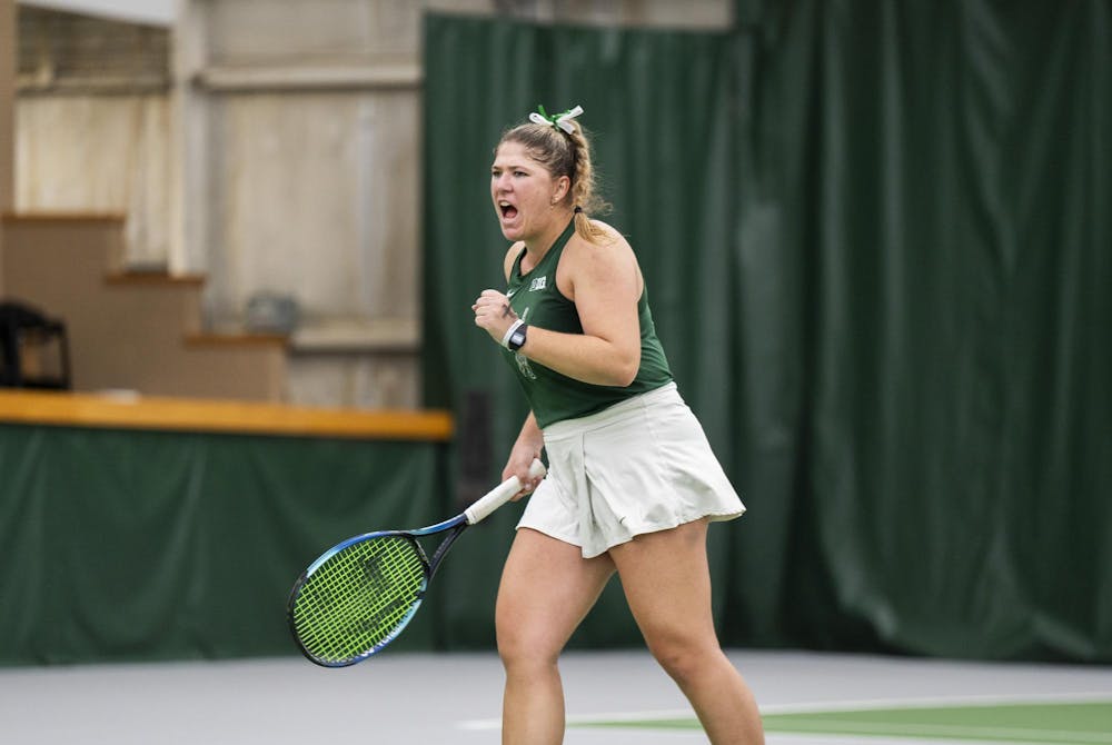 MSU grad student Nicole Conard celebrates her winning against Purdue Junior Tara Katarina Milic at the MSU Tennis Facility on Mar. 30, 24.
